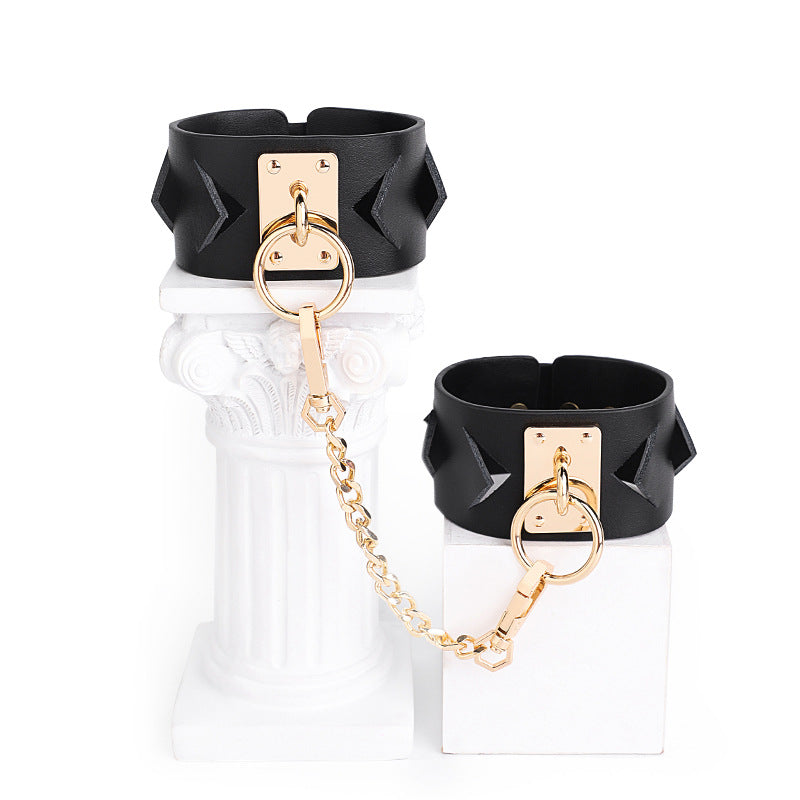 Chic Black Leather Restraint Set with Gold Accents and Diamond Cutouts