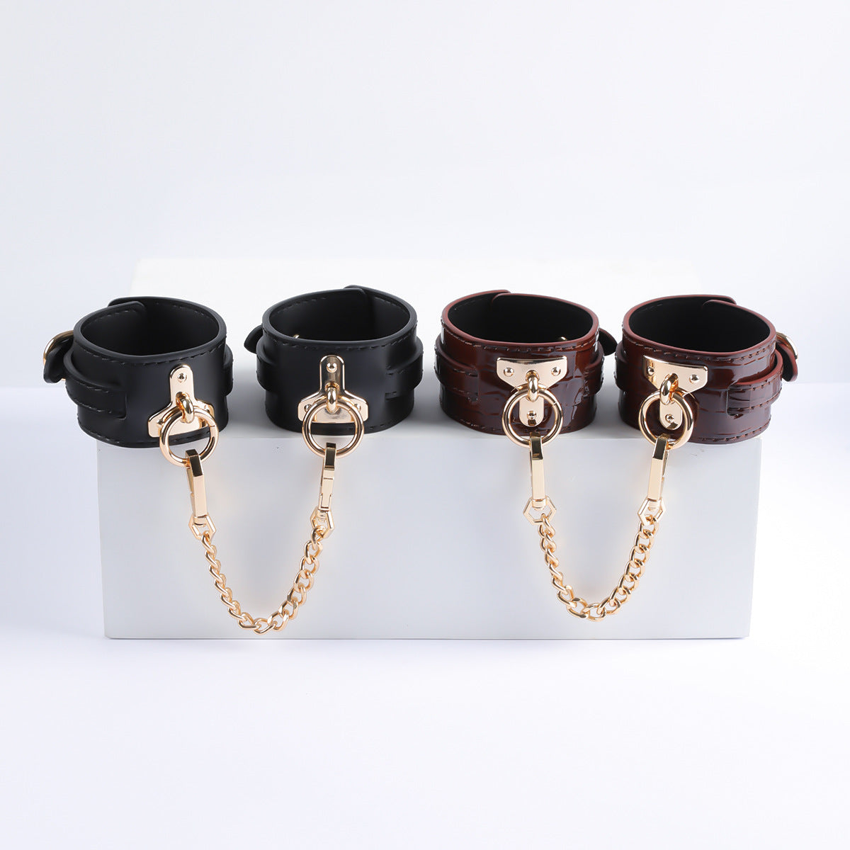 Gilded Embrace Leather Handcuffs
black and brown 