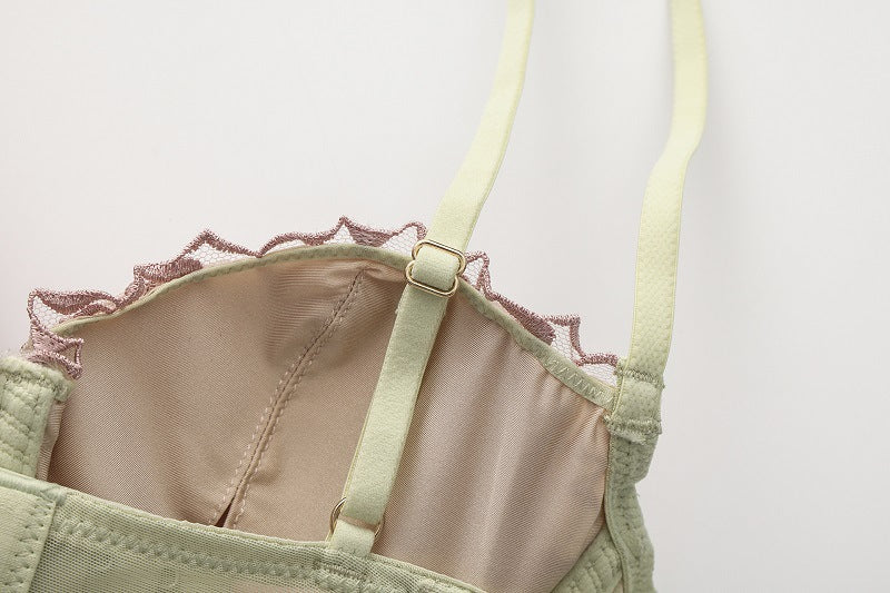 Detail of the slim, adjustable shoulder straps with gold-tone hardware.