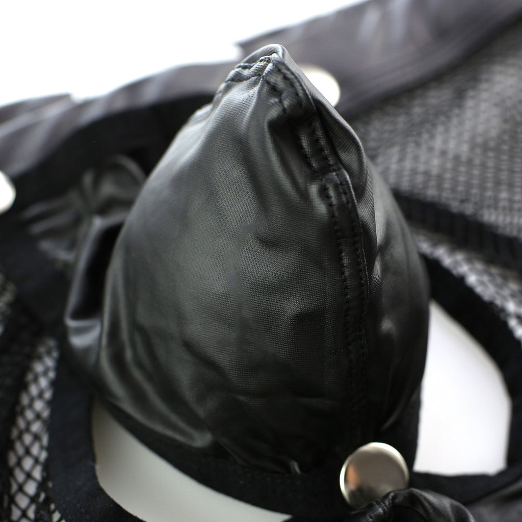 Close-up of detachable matte pouch showing snap attachment and smooth finish.