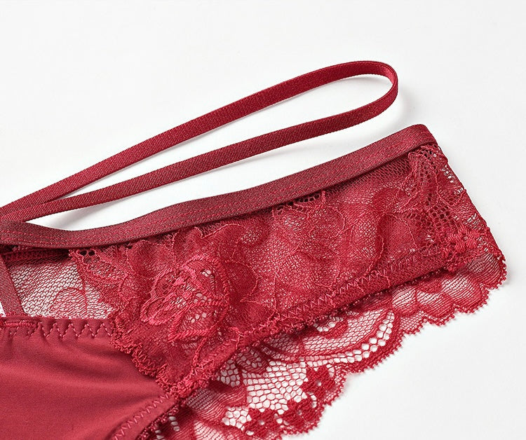Close-up of the modern double-strap waistband and scalloped lace hip finish.