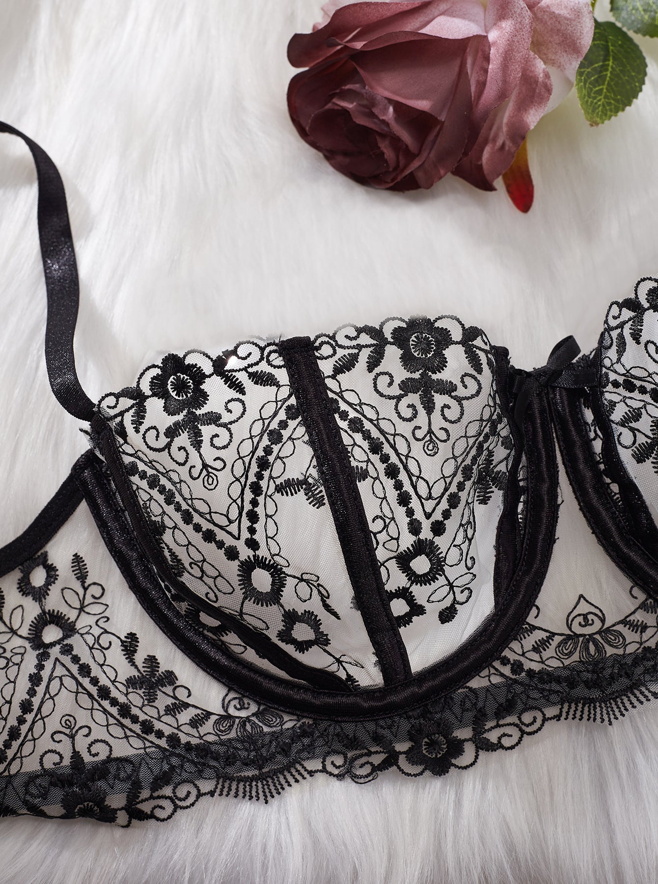 A high-definition close-up of the Midnight Muse bra. The flat lay captures the "ink-on-skin" embroidery detail and the scalloped edges of the sheer unlined cups.