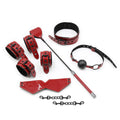 A complete 6-piece red patent leather sensory set from the After Dark collection by Mooods, featuring cuffs, riding crop, mask, and gag.