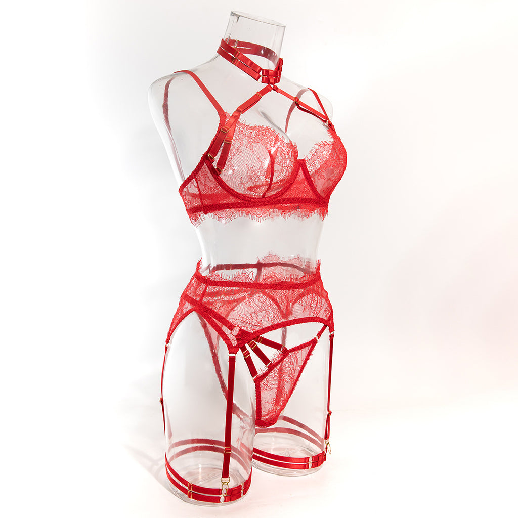 An angled front view of the red floral lace set, highlighting the adjustable velvet straps and gold accents.