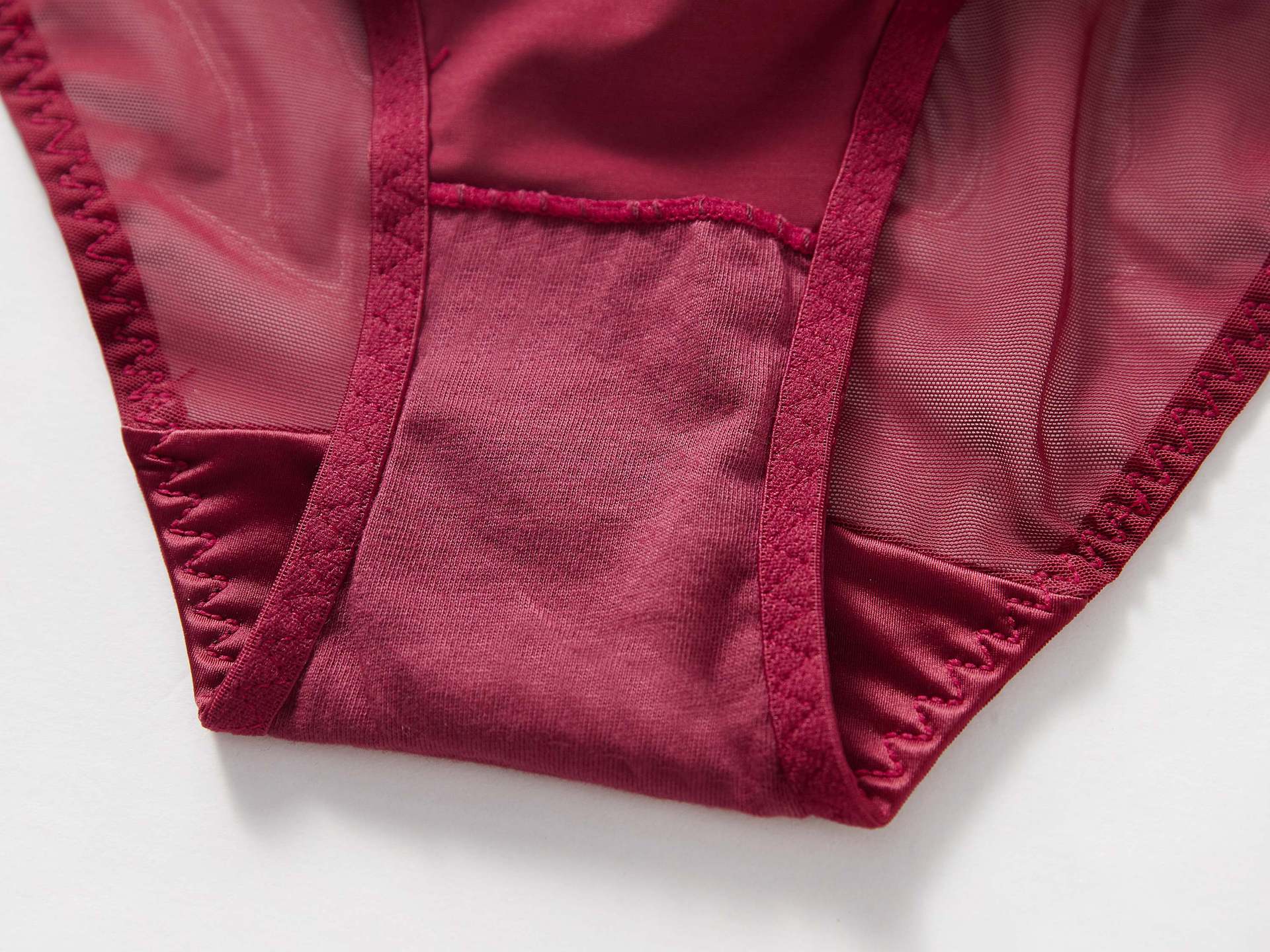 Close-up of the internal 100% pure cotton gusset lining for the Crimson Veil Geometric Mesh Brief.