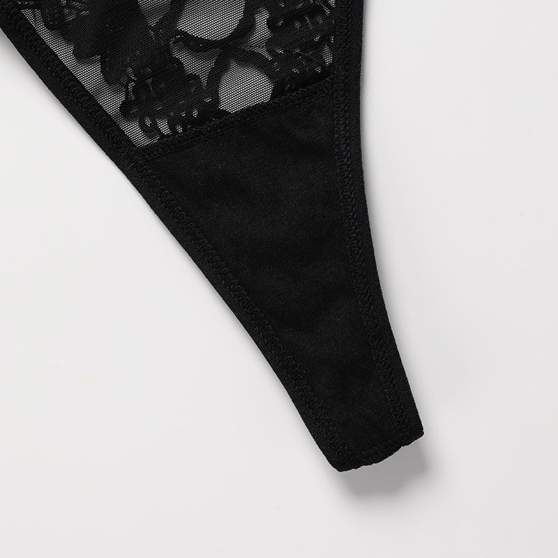 Thin side strap detail on a semi-sheer lace thong panty.