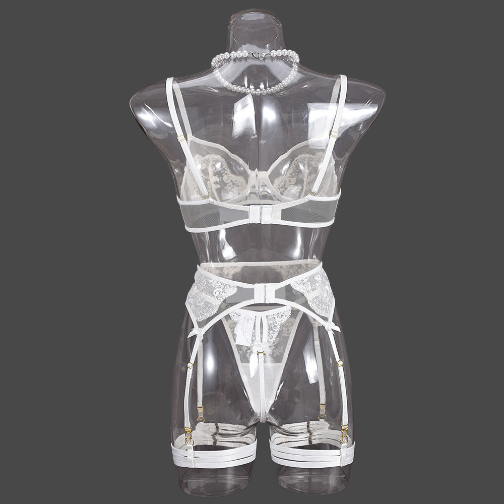 Rear view on a transparent mannequin, detailing the symmetrical strap arrangement and the clean white mesh finish.