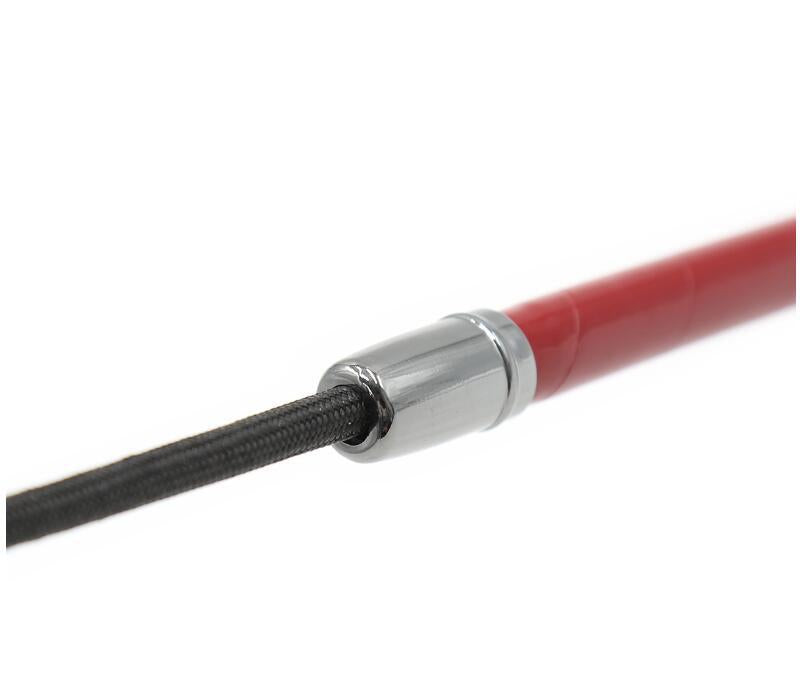 Macro shot of the flexible, precision-wrapped red patent leather shaft, highlighting the light-reflective finish and high-quality construction.
