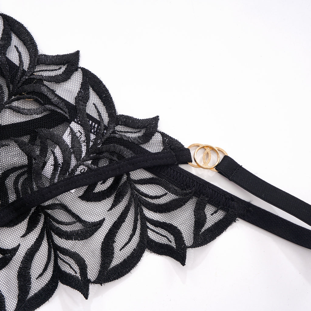 Close-up of the fixed side straps and polished metal ring accents on the hip.