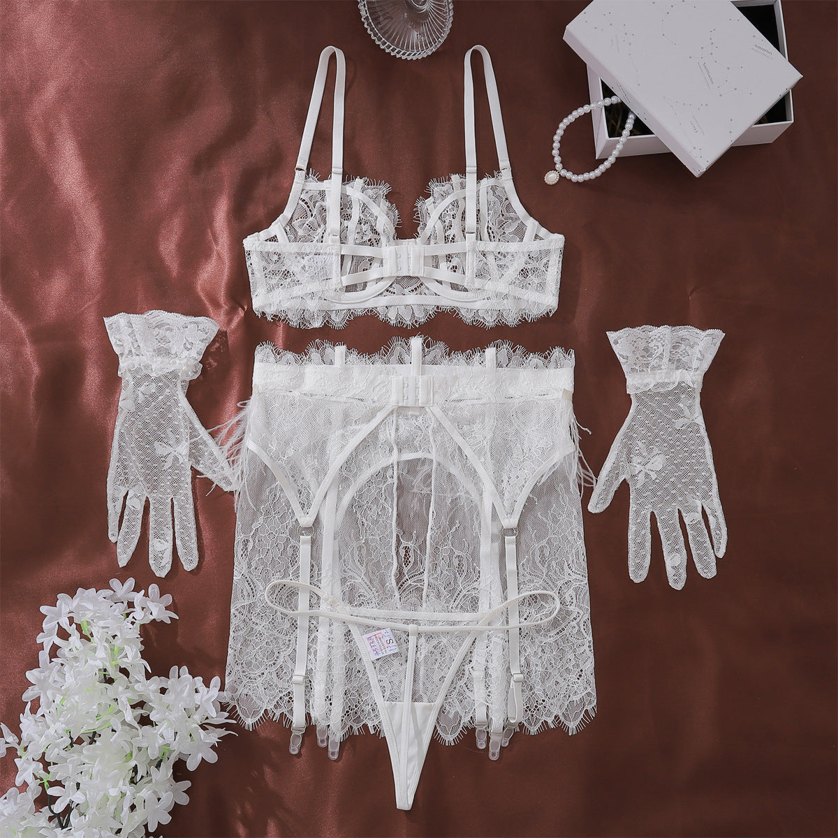 A complete back view of The Weightless Hour 4-piece set, demonstrating the adjustable fit of the garter skirt and gloves.