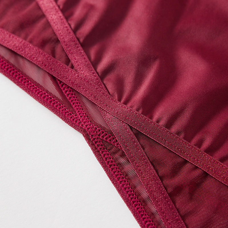 Close-up of the reinforced geometric crossover waistband on the Crimson Veil brief.