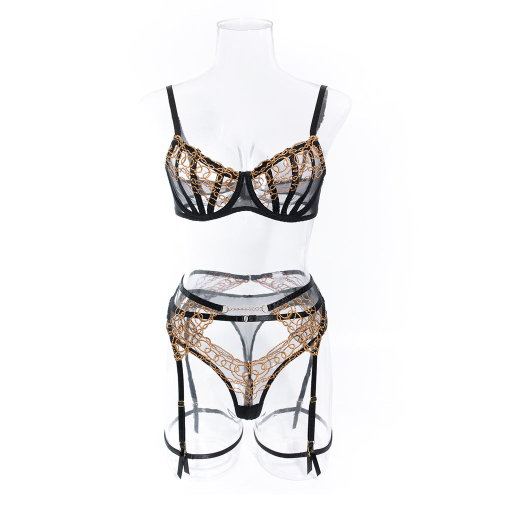 Front view on a transparent mannequin, illustrating the "floating" effect of the golden chain motif.