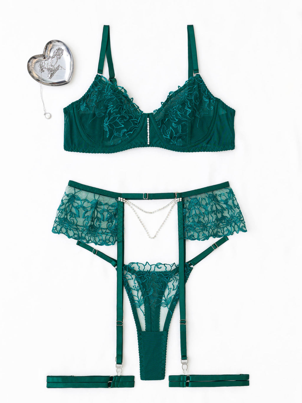 Studio flat lay of the 3-piece emerald green set on a white background, highlighting the sheer embroidery and jewelry-inspired pearl chain.