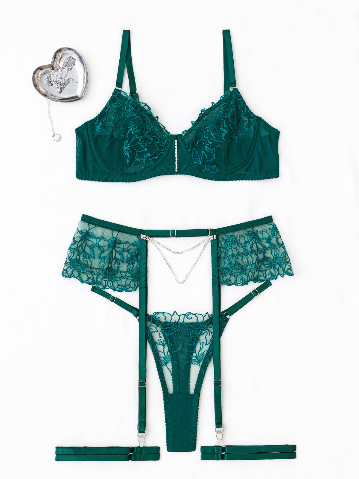 Studio flat lay of the 3-piece emerald green set on a white background, highlighting the sheer embroidery and jewelry-inspired pearl chain.