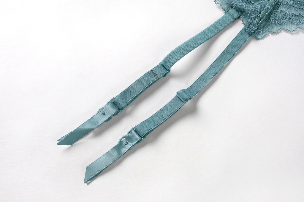 Adjustable garter straps with refined lace texture in luxury garter belt design. 