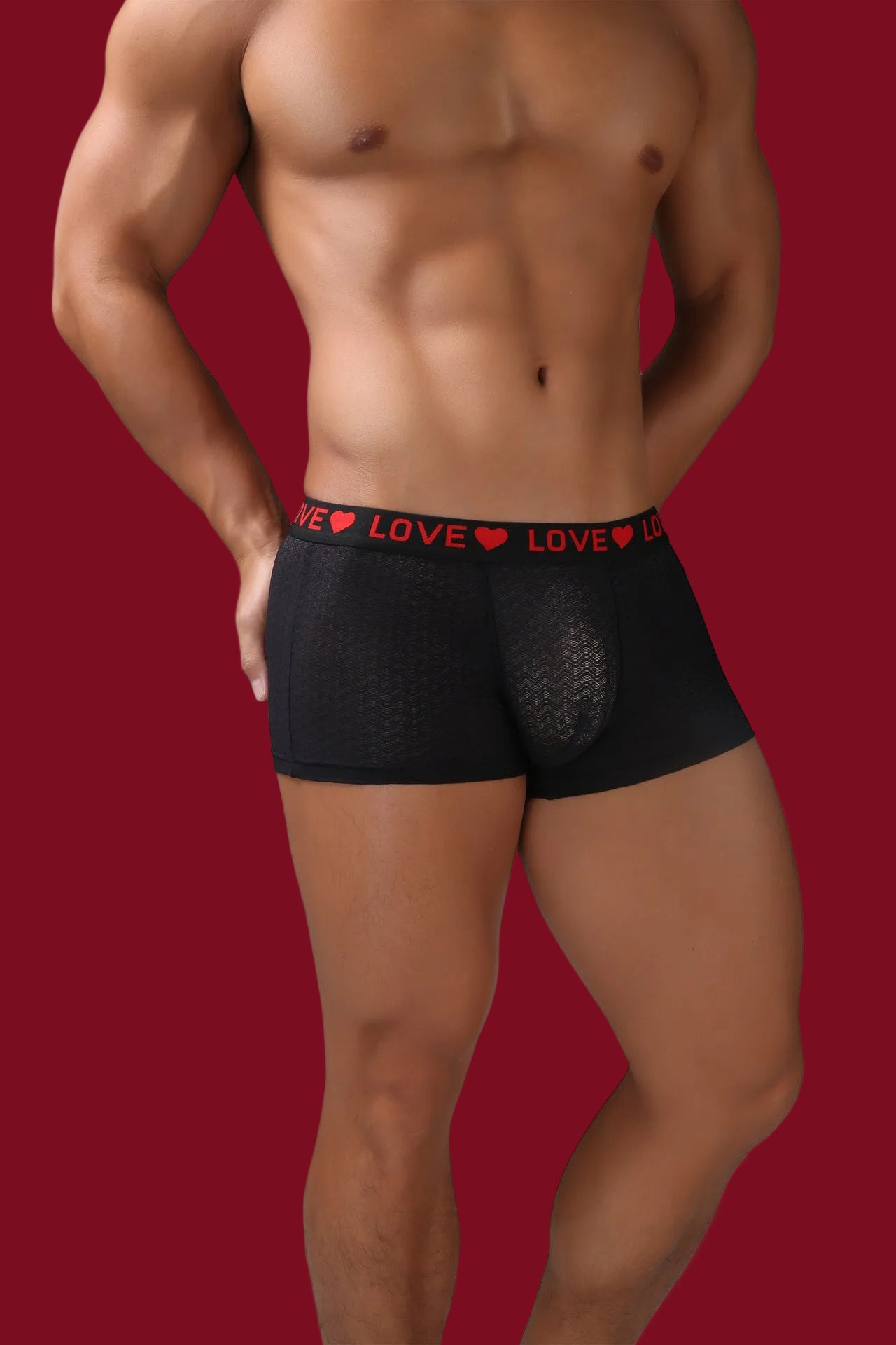 Men’s black sheer boxer underwear with lightweight mesh and modern design.