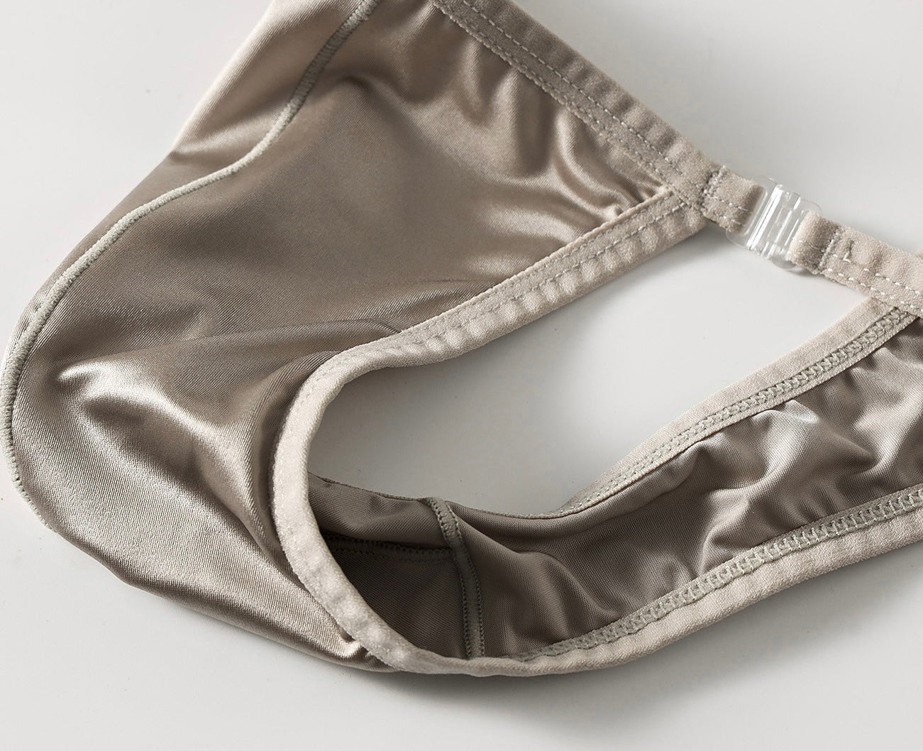 Close-up of satin-effect nylon fabric used in luxury men’s thong lingerie for smooth lightweight feel.