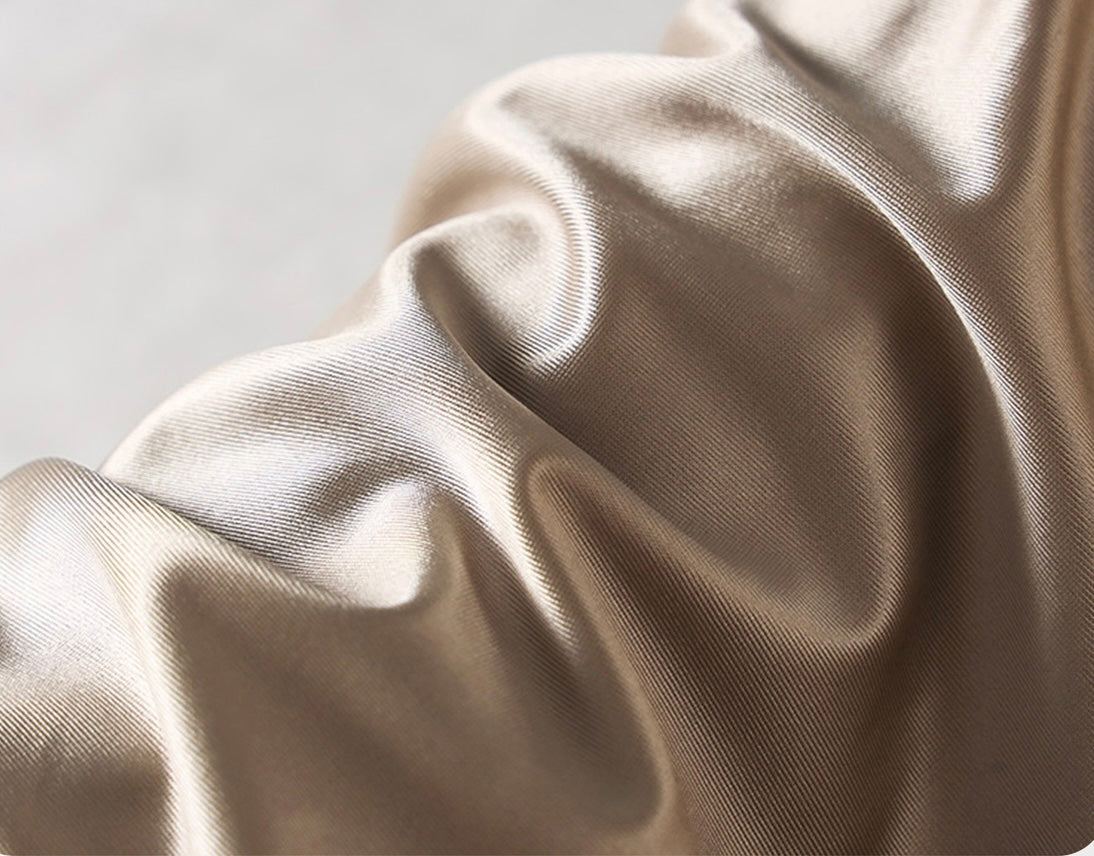 Technical close-up showing the high-clarity transparent elastic and smooth stretch fabric of the Lucent thong.