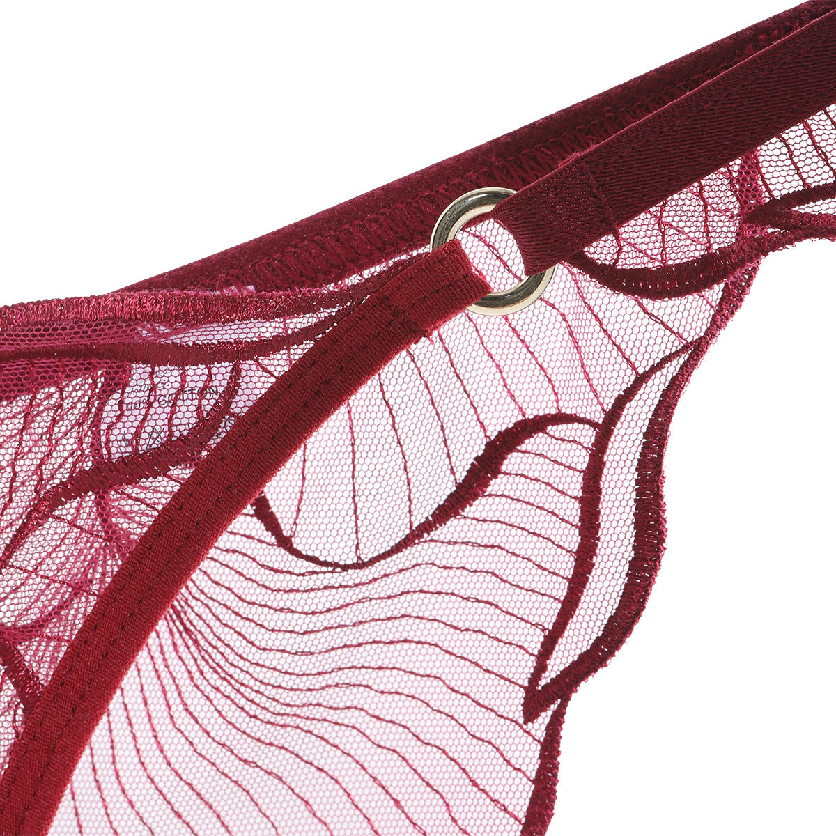 Close-up of the decorative gold-toned hip rings on the Velour Tide wave-inspired embroidered brief, crimson.