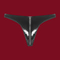A direct front view of the Black Mirror thong. The shot captures the flat, liquid-like shine of the onyx vinyl and the precise vertical placement of the industrial zipper.
