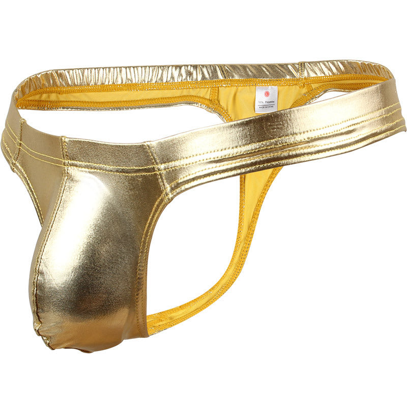 Side profile of a 3D gold metallic thong, emphasizing the athletic silhouette and low-profile cut.