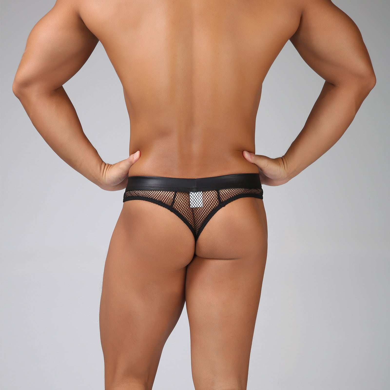 Back view of The Onyx Vector matte-finish tech mesh brief, showcasing mesh paneling and sculpted rear fit. 
