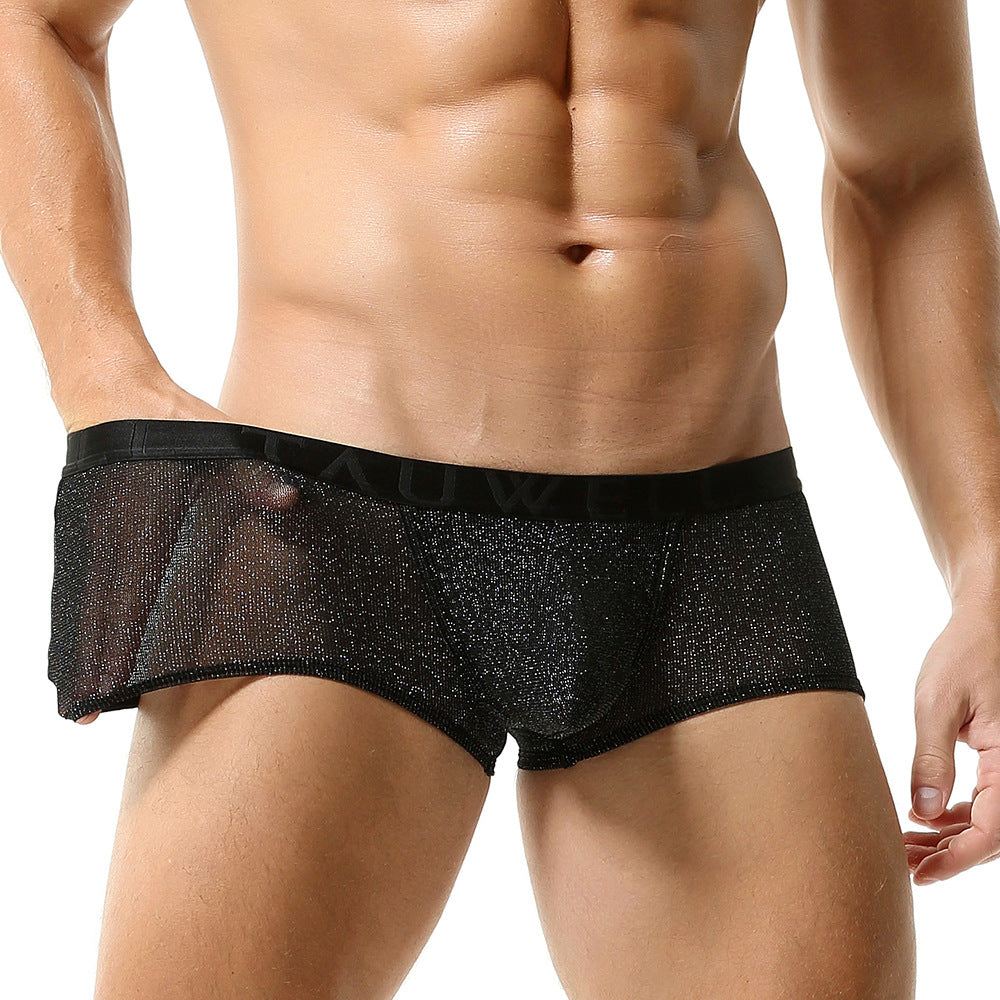 A close-up front view demonstrating the stretch of the obsidian mesh. Hands apply gentle tension to the fabric, revealing its high-gauge transparency and the strength of the glitter-weave.