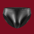 A front-facing 3D view of The Static brief, showing the non-reflective obsidian finish and the vertical seam that structures the pouch.