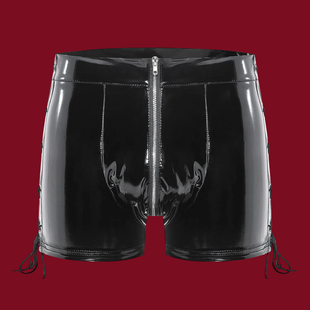 A 3D front view of the Trace Line vinyl shorts, showcasing the high-gloss obsidian finish, structured waist, and the central silver-tone zipper.