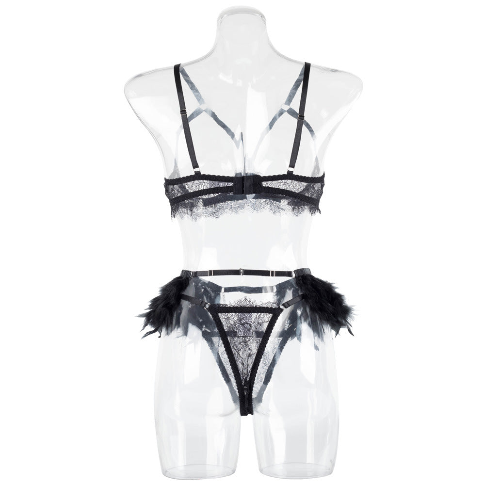 Rear view on a transparent mannequin, detailing the clean strap placement and the symmetrical finish of the lace thong.