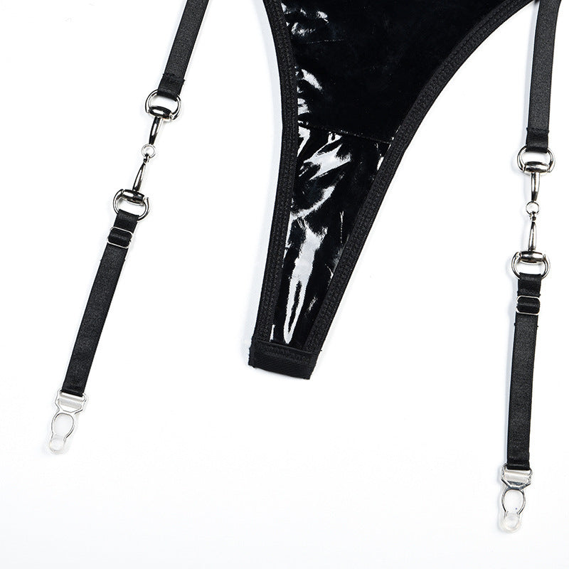 Detail of detachable garter lines on Noir Voltage vinyl bodysuit. 