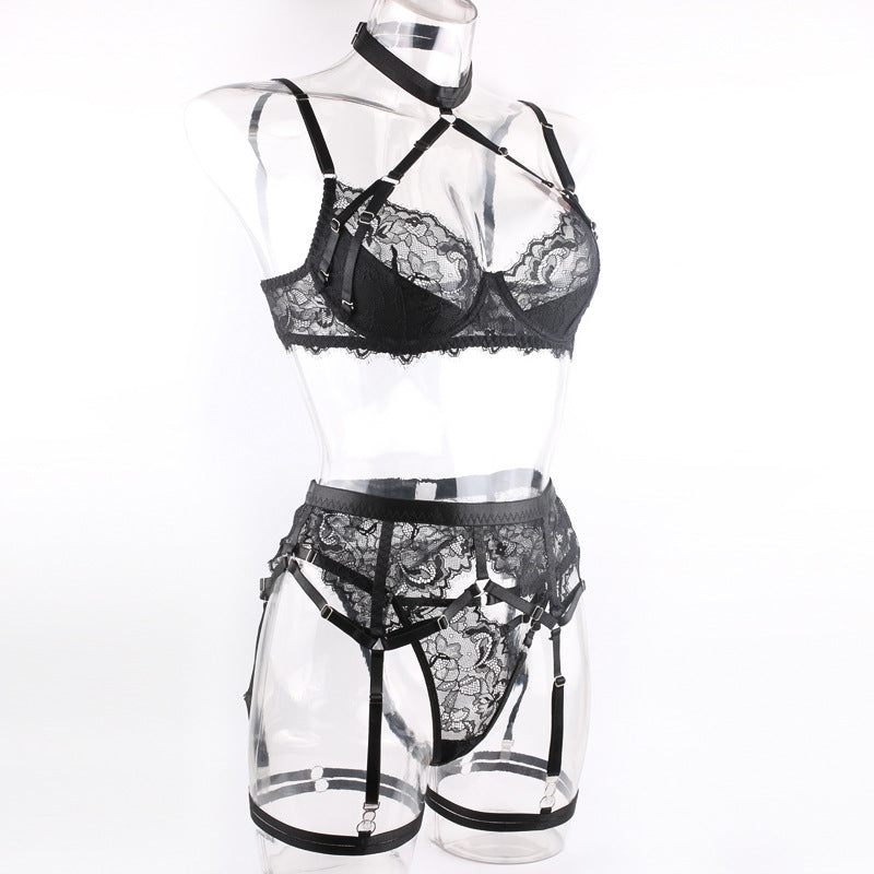 Side view on a transparent mannequin, illustrating the "floating" lace effect and the precise finish of the harness straps.