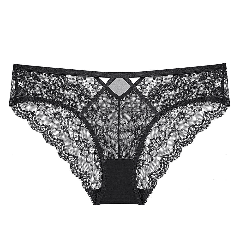 Flat lay of the Obsidian Noir floral lace brief, showcasing the sharp architectural lines of the diamond-shaped waist detail.