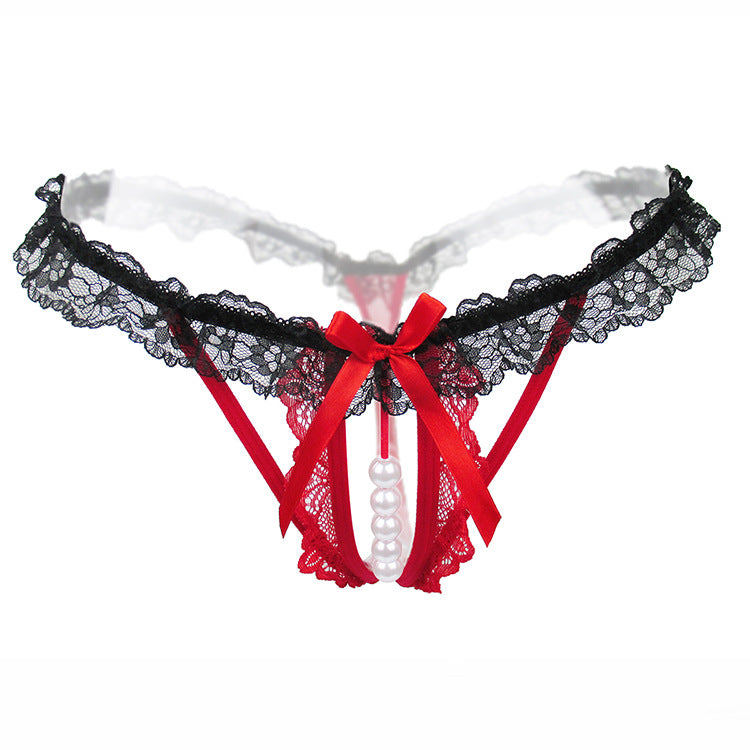 Front view of the Lyra open crotch pearl thong with black lace ruffles.