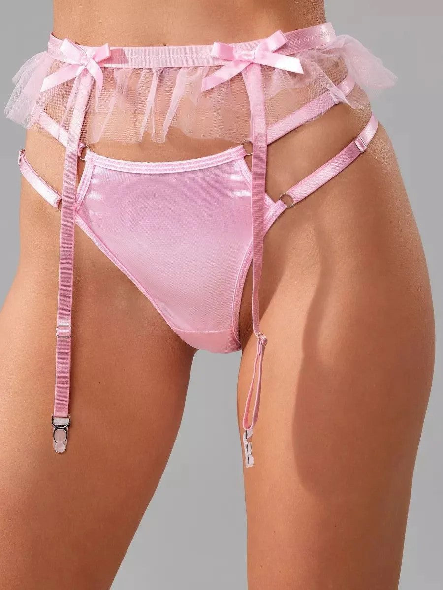 Close-up of the satin bra and ruffled garter, highlighting the tender sophistication and boutique craftsmanship.