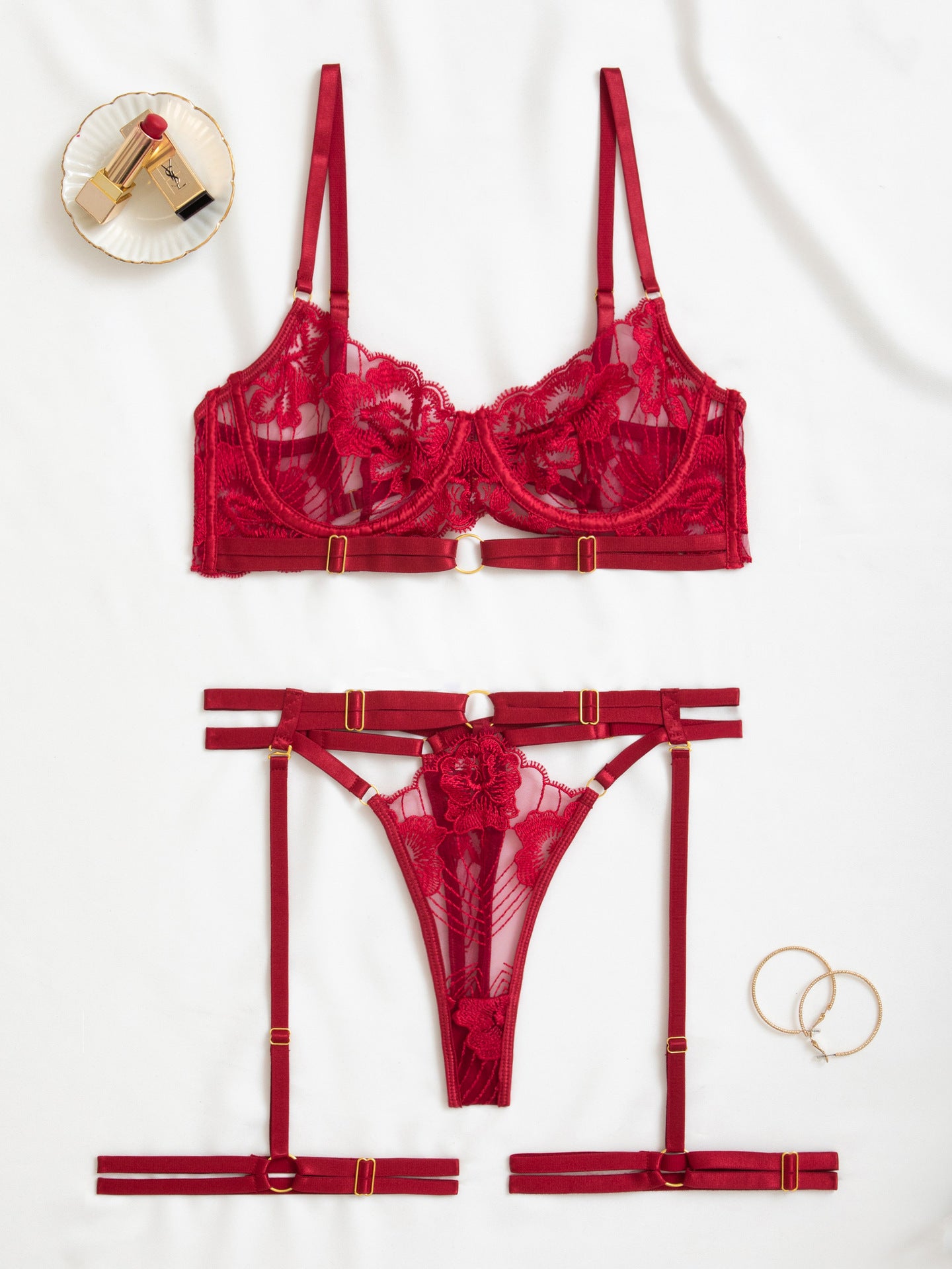 Flat lay of the Dark Red Amaranthine set highlighting the geometric harness lines.