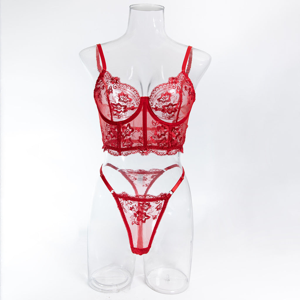 Front mannequin display of the red embroidery set, a definitive anchor for a wardrobe of distinction.