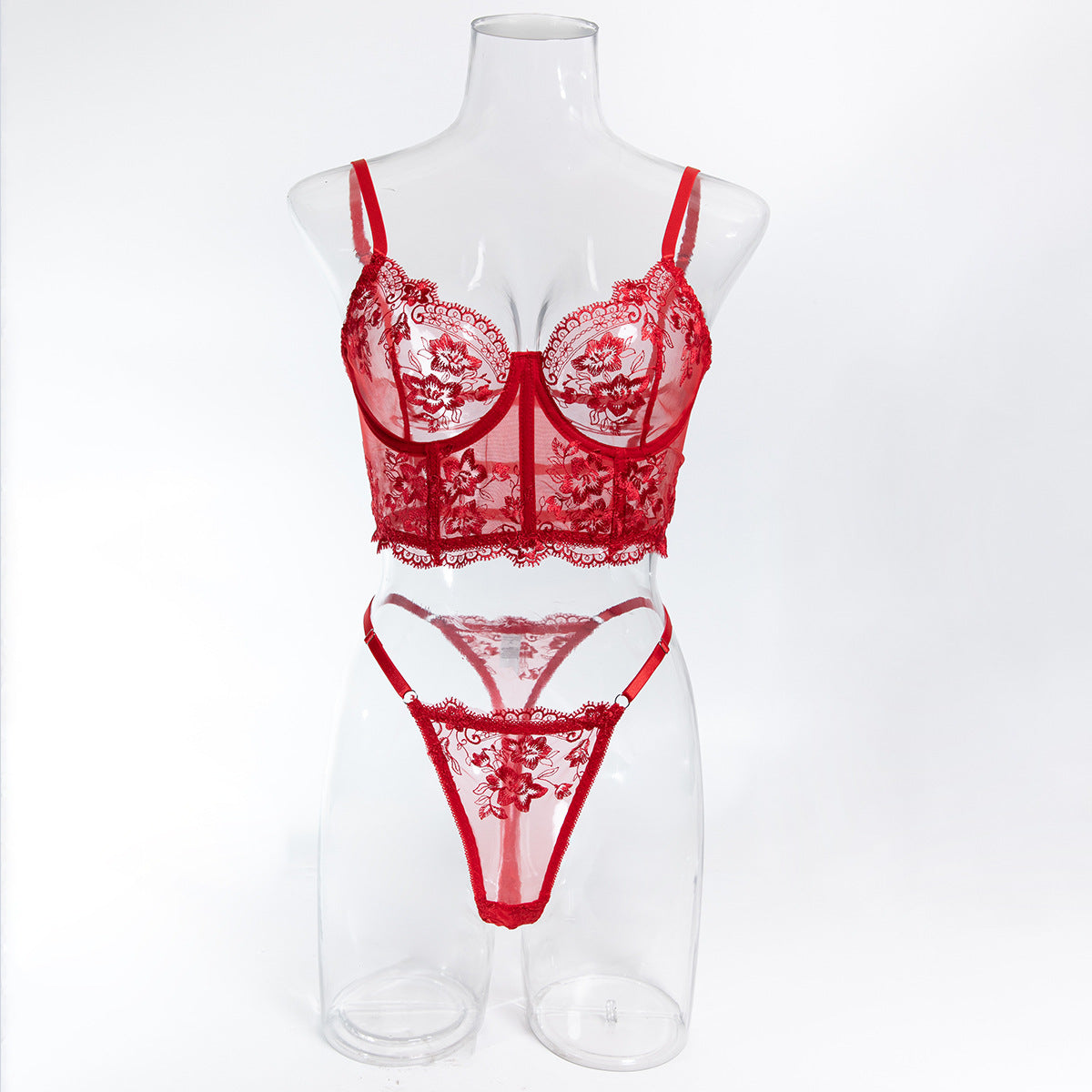 Front mannequin display of the red embroidery set, a definitive anchor for a wardrobe of distinction.