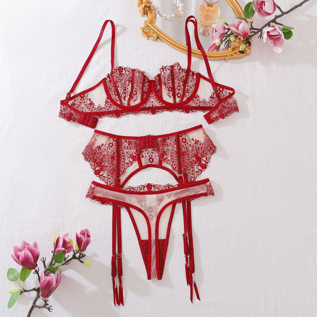 The back architecture of The Midnight Muse in red. This view highlights the adjustable strap system, the secure hook-and-eye fastenings, and the clean geometric lines of the thong and garter back.