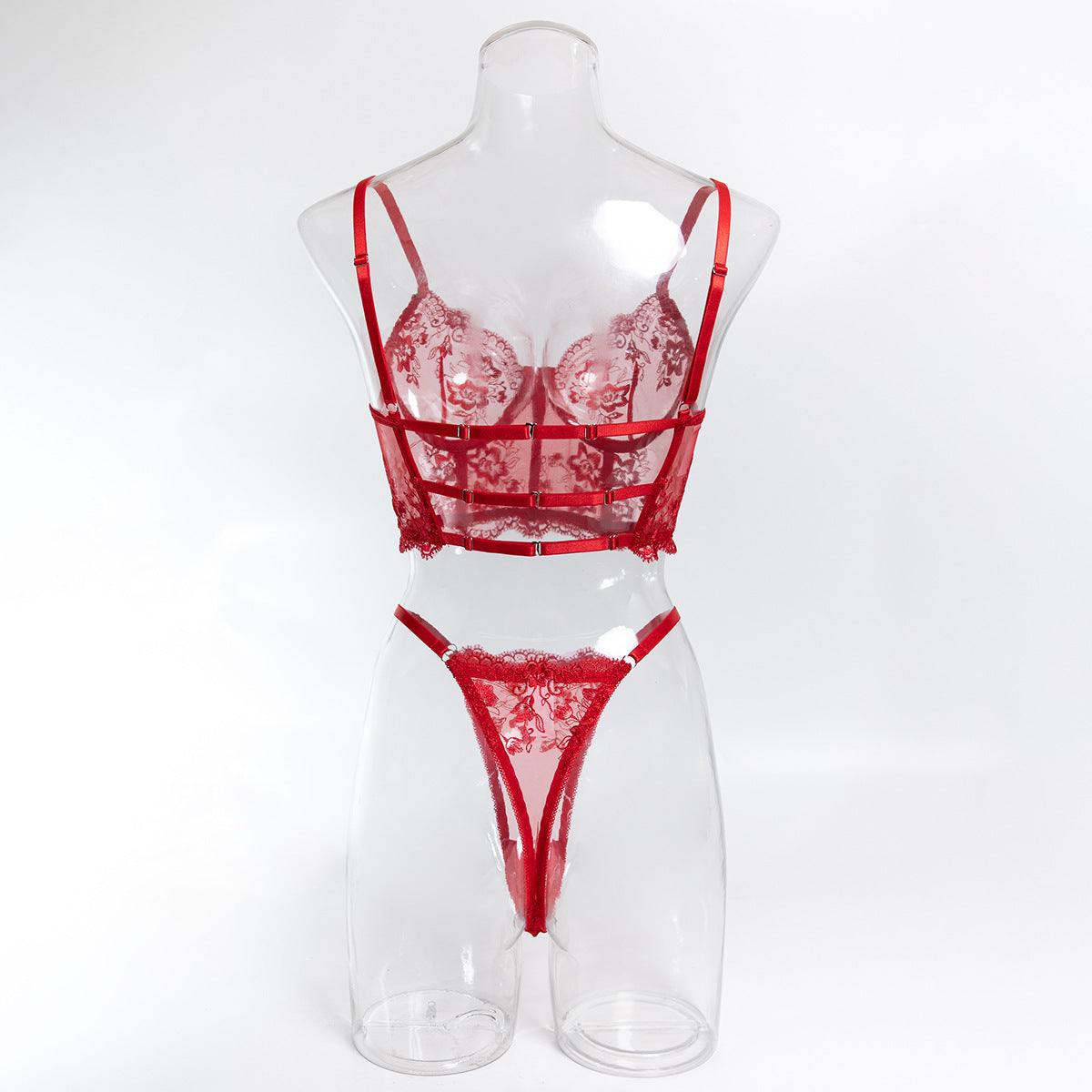 Rear view of the red longline ensemble, highlighting the high-cut thong and the weightless support of the frame.