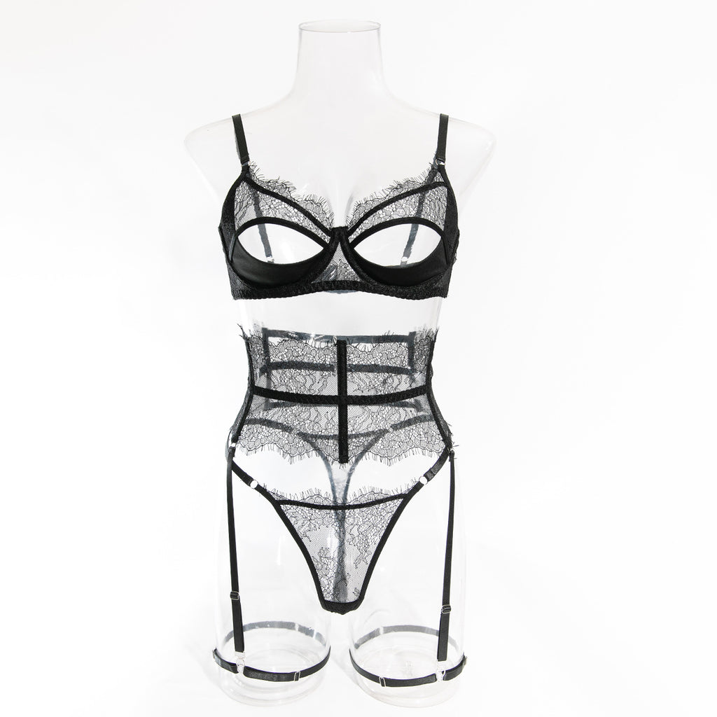 Front view of the Refined Desire set on a transparent mannequin, showcasing the lash-lace longline garter and the bold cutout underwire bra.