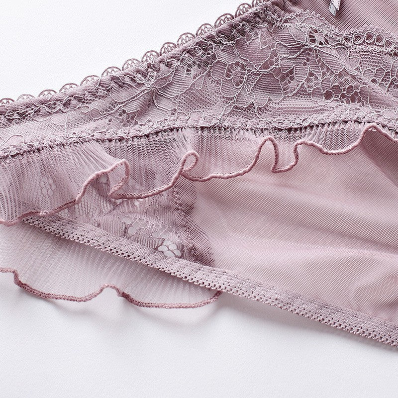 Macro shot of the soft lace ruffles and transparent mesh fabric.