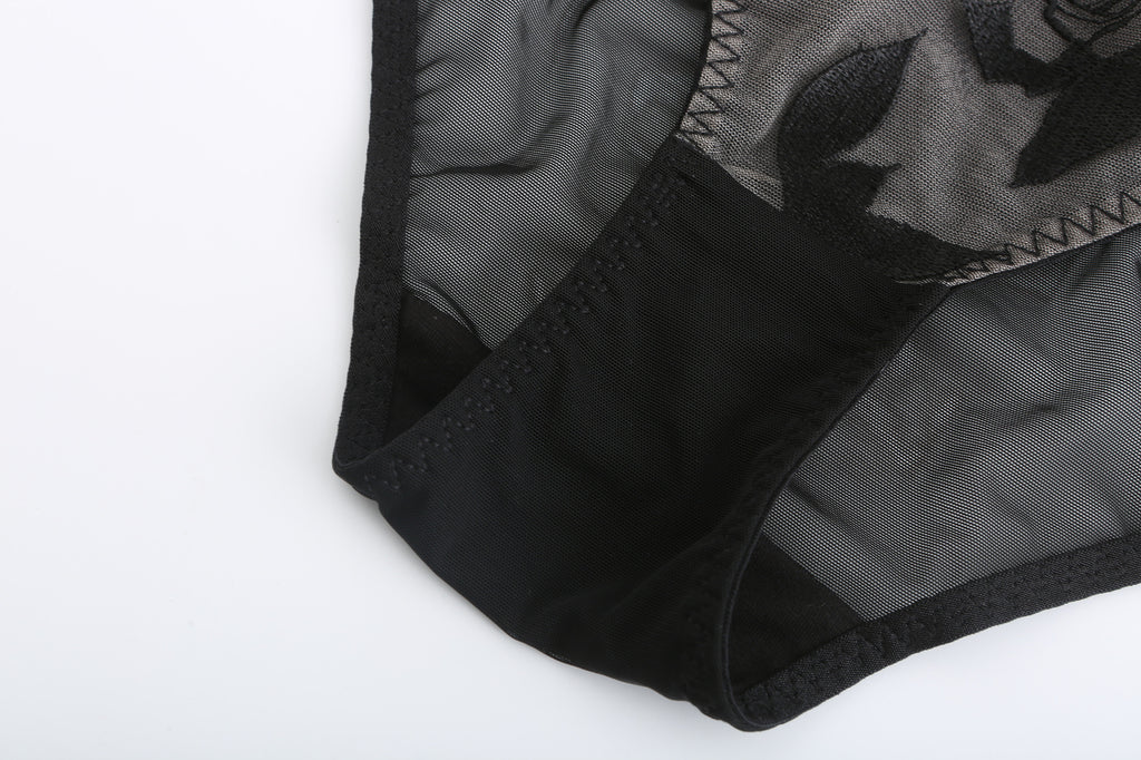 Flat lay exterior view of the black Rosaine Rose embroidered lingerie.