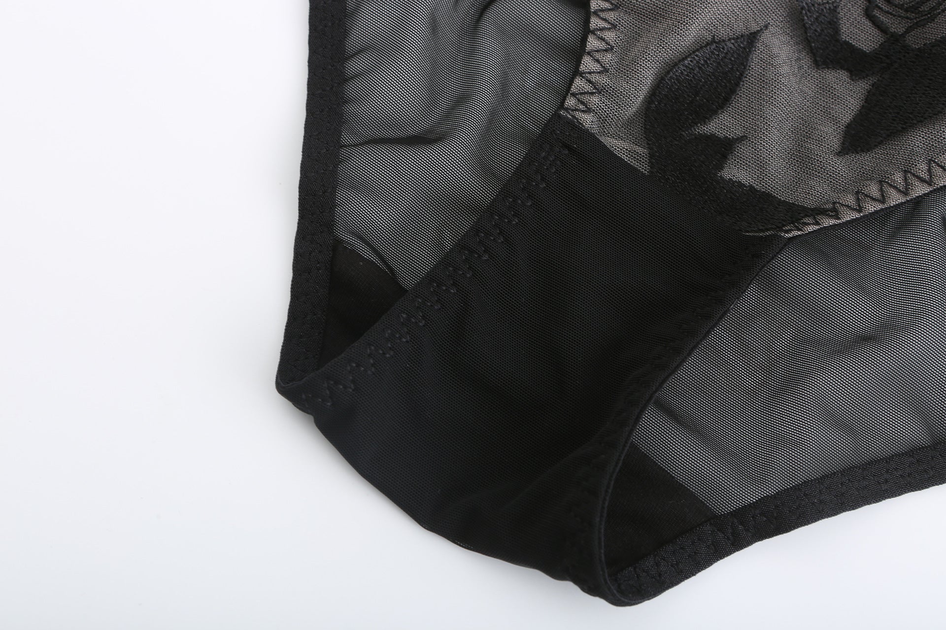Flat lay exterior view of the black Rosaine Rose embroidered lingerie.