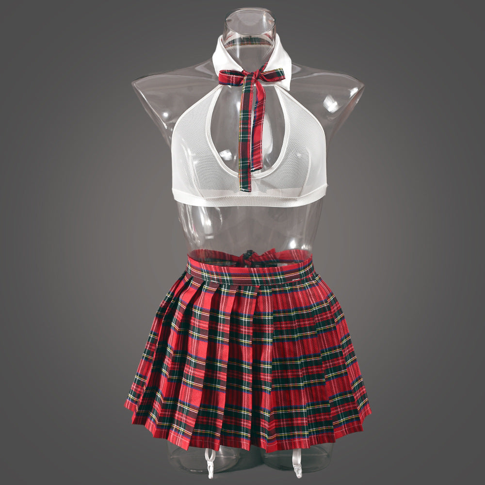 Front view on a transparent mannequin, illustrating the "floating" mesh effect and the precise pleating of the red skirt.