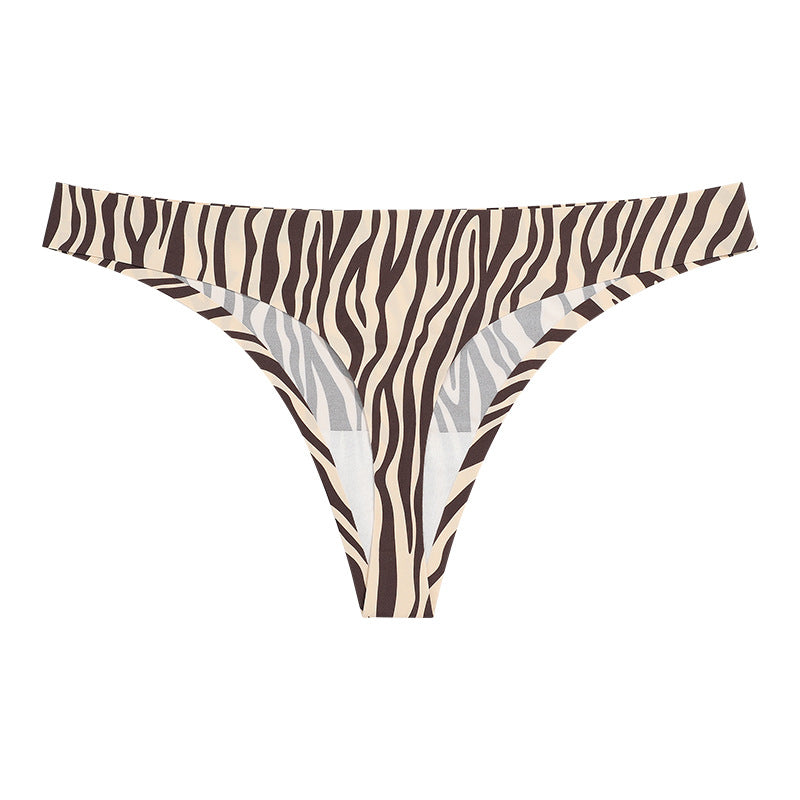 Studio rear view showing the sleek thong back design and high-stretch seamless edges, zebra.