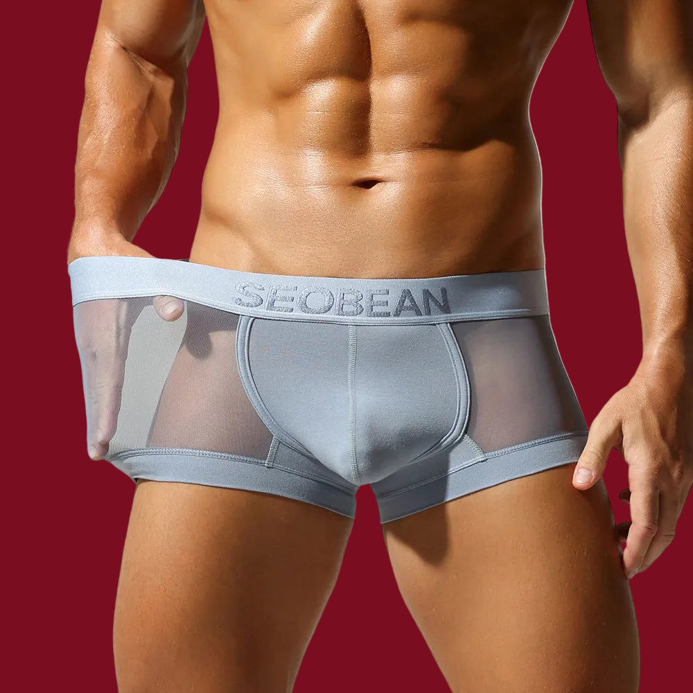 Close-up of SEOBEAN ice blue trunk fabric being stretched to demonstrate the high-tension elastic recovery.