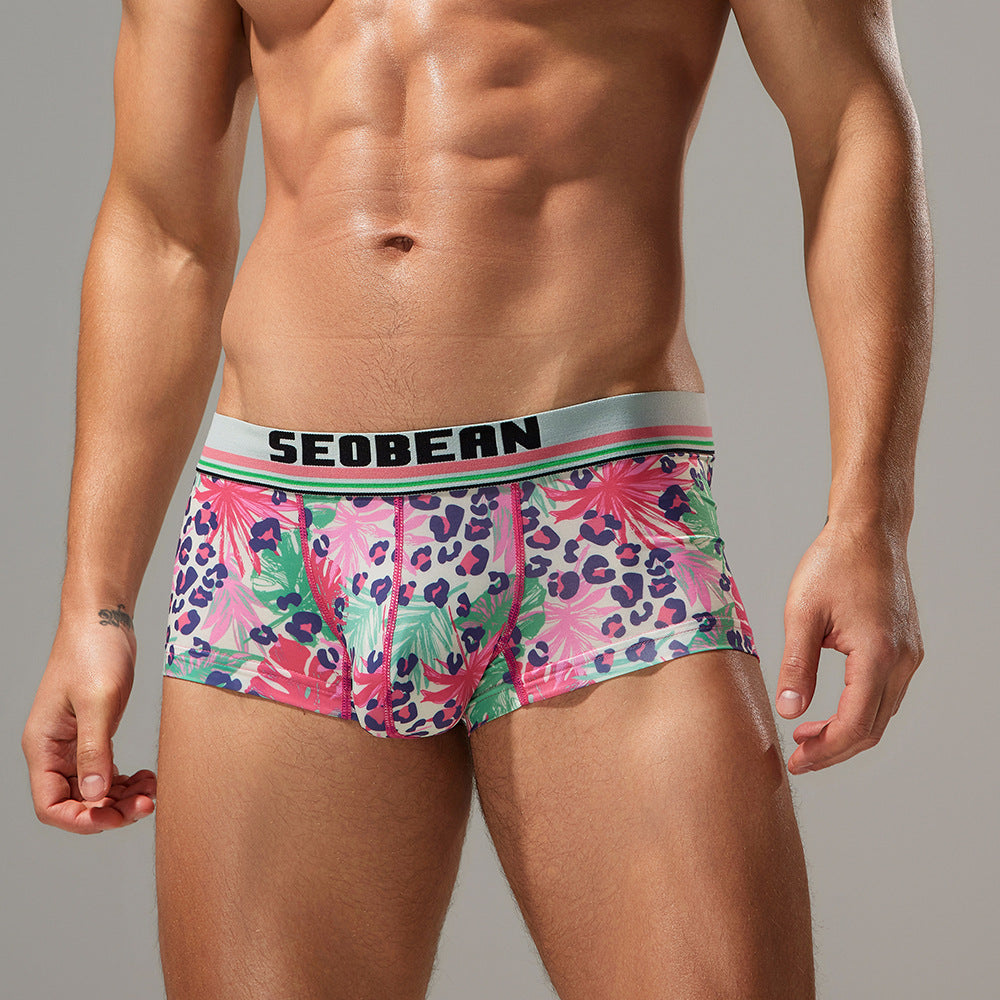 Side profile of the watercolor leopard boxer in a lifestyle setting, demonstrating the smooth no-ride leg construction.