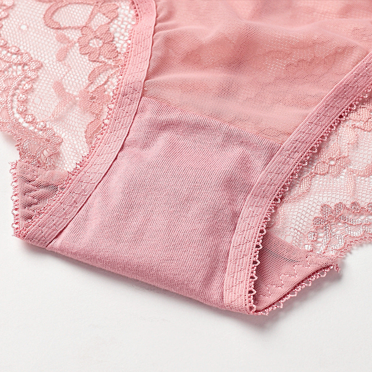 A close-up view of the sheer botanical lace and the soft, 100% breathable cotton lining for essential hygienic comfort.