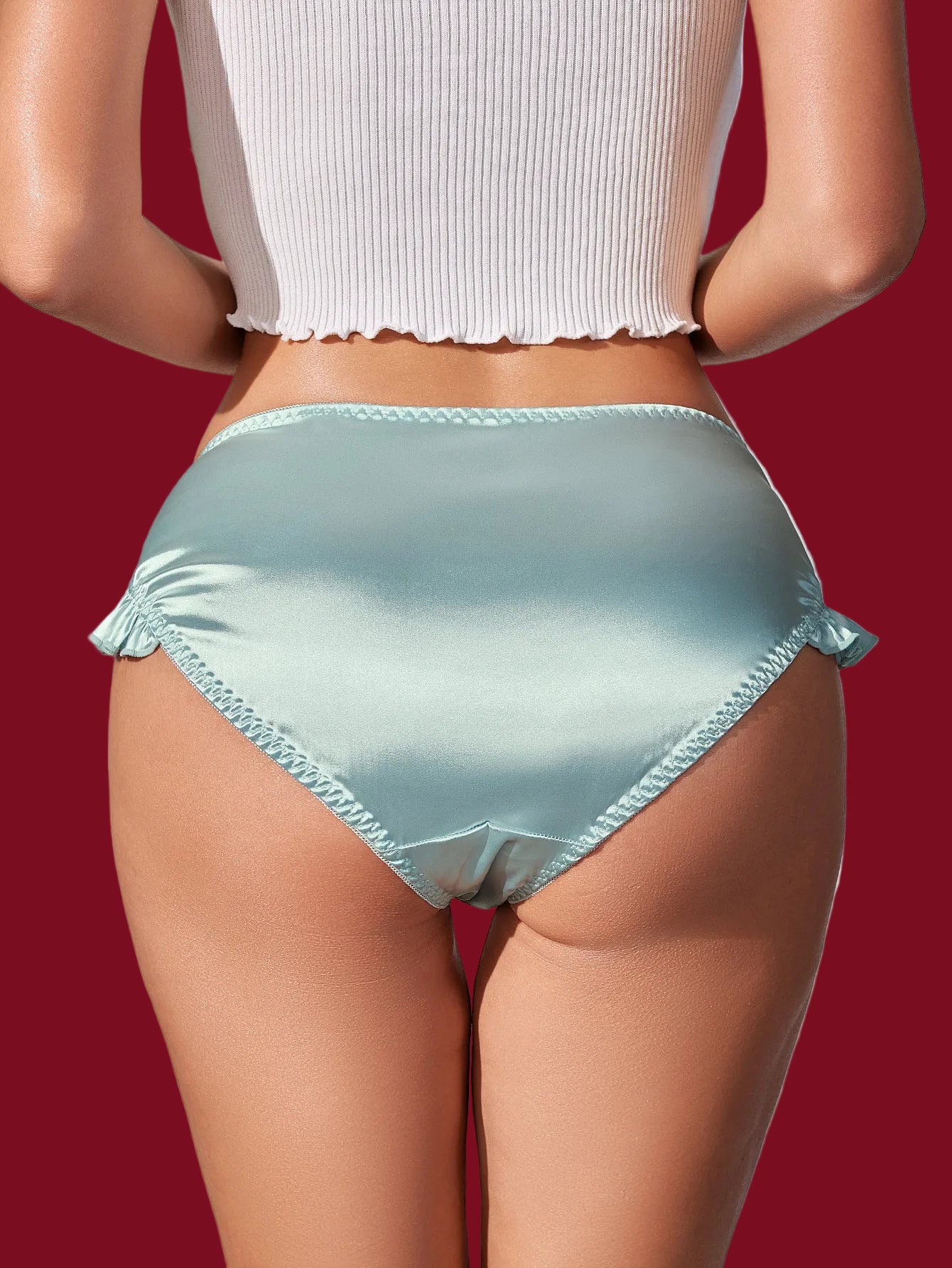 Back view of a mid-rise satin panty with a smooth, clean silhouette.